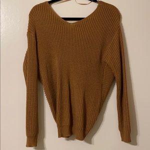 Brown sweater with knot on back